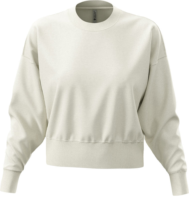 Ženski oversize pulover Next Level Apparel, udoben in moderen, v sivkasti barvi, prikazan na modelu.