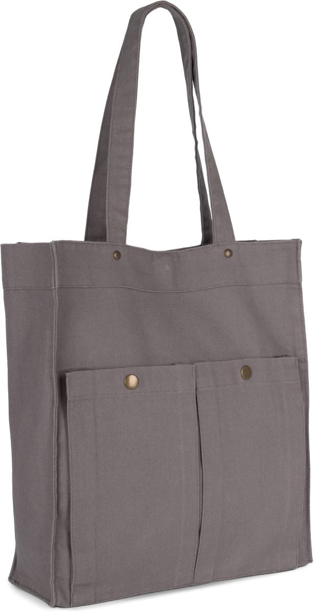 Unisex bombažna torba KiMood, praktična in udobna za vsakodnevno uporabo, prikazana na sliki.